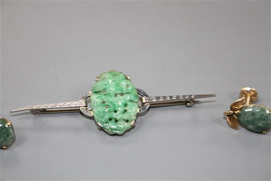 A 9ct white metal and carved oval jade plaque set bar brooch and a pair of 14k and simulated jade earrings,